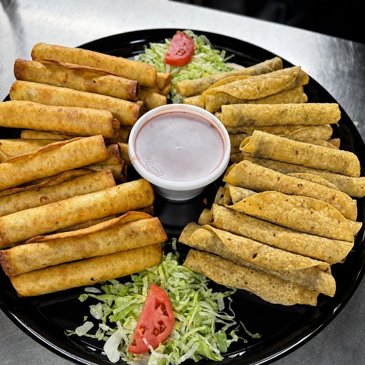 Large El Charro Cafe rolled taco catering tray prepared for a Yuma gathering